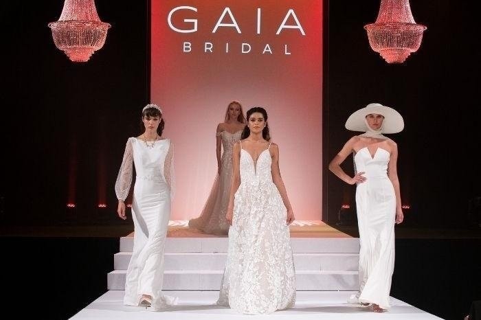 Models walking down the runway in bridal gowns