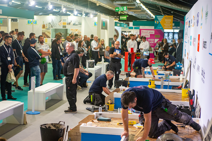Visitors watch demos at a busy corner at the Harrogate Flooring Show 